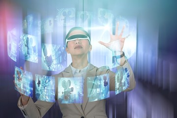 Composite image of businesswoman wearing virtual video glasses