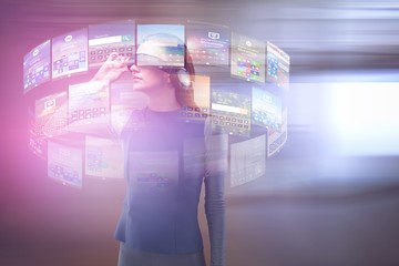 Composite image of woman experiencing virtual reality headset