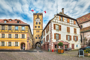 HDR-image of historical clock tower with gate in Ribeauville, Alsace, France