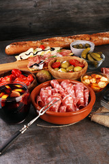 spanish tapas and sangria on wooden table - mediterran antipasti