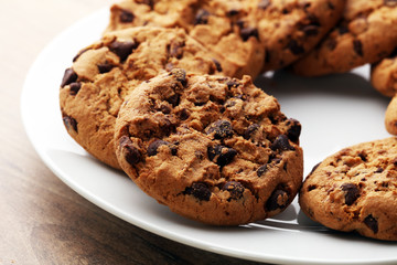 Chocolate cookies on wooden table. Chocolate chip cookies shot