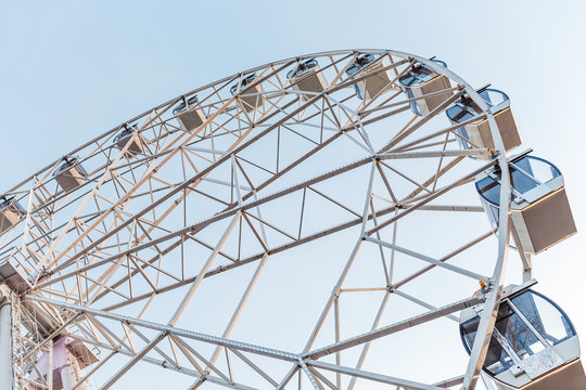 Modern Ferris Wheel detail Over Blue Sky