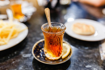 Turkish authentic tea in a traditional glasses in cafe