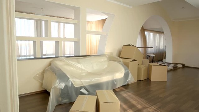 Cardboard boxes indoor of house. Modern apartment interior.
