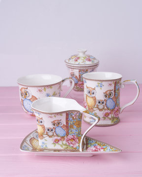 A cup. Owl. Pink