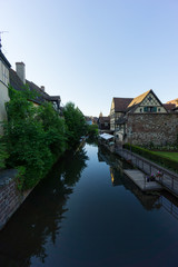 Fototapeta na wymiar Dawn at the canal of little venice in Colmar with historic houses