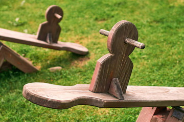 Wooden equipment on kinds playground in mountains