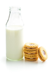 Jam ring biscuits and bottle of milk.
