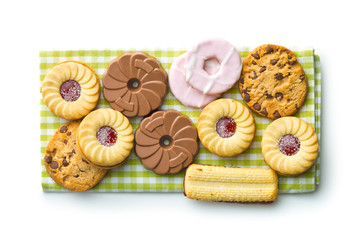 Various sweet biscuits on checkered napkin.