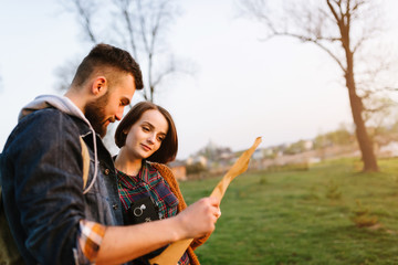 Couple in love, traveling with a map