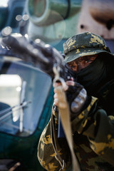 Photo of a soldier with an automatic rifle