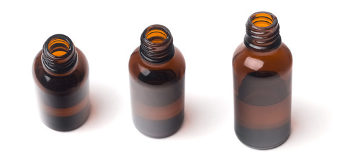 Close up of a small medical brown glass bottle isolated on white different views
