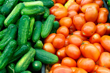 Fresh Tomatoes and Cucumbers at a Farmers Market