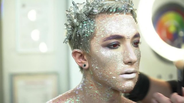 Process of the face art creation closeup