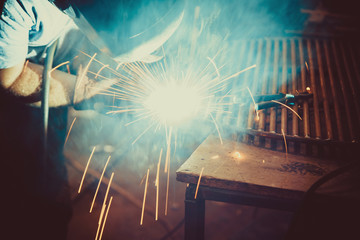 Welding Work. Erecting Technical Steel Industrial Steel Welder In Factory. Craftsman. Soft focus. Shallow DOF.