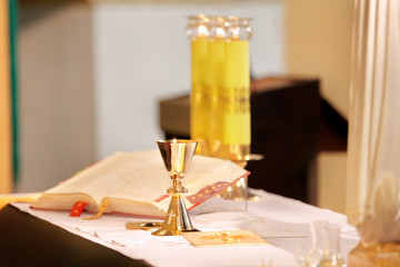Naklejka na ściany i meble Golden chalices during the mass