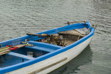 Fototapeta na wymiar Blue boat at sea