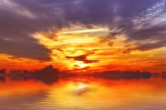 Amazing colorful sea sunset landscape with fantactic colors in the sky and reflection in the water. Beauty world natural outdoors travel background