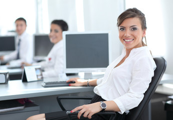 Fototapeta premium Beautiful young woman looking at camera with smile at the modern