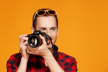 smiling guy with camera in his hands