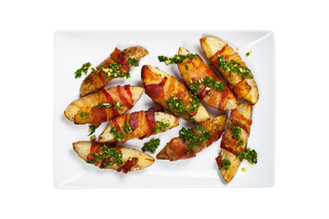 Bacon Wrapped Potatoes Wedges with Parsley Garlic Pesto Sauce Isolated on White background