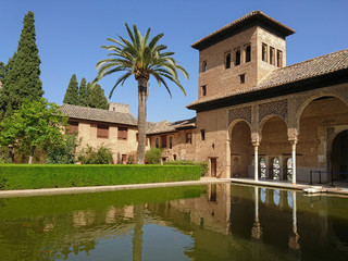Fototapeta na wymiar Reflection of the Partal Palace on a pond, Alhambra, Granada