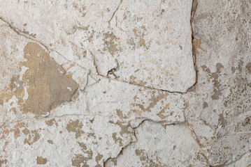 old chipped plaster on the concrete wall, white background, texture