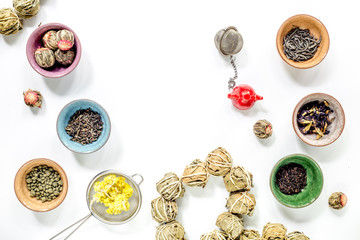 Tea-party with different herbal tea on white desk background flat lay mock up
