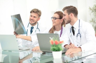 Portrait of confident happy group of doctors working at the medi