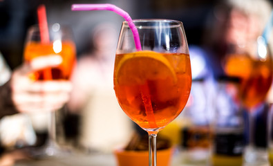 Orange tincture apero, refreshing drink with ice and lemon