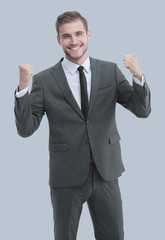 Excited smile business man raised arms, isolated over gray backg