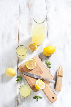 Lemonade bottle and lemons.