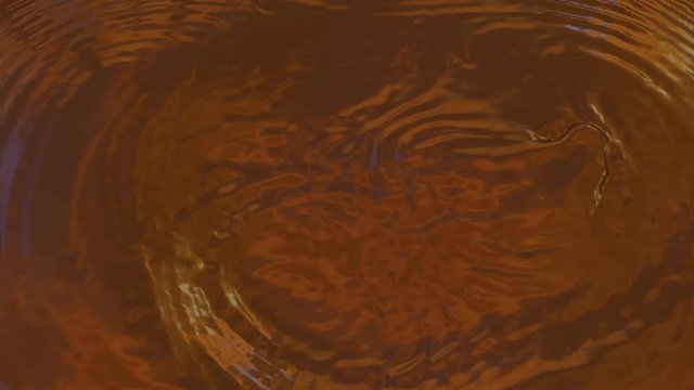 Animated chocolate bar falling into the melted chocolate in slow motion. Enhanced with special HDRI lighting.