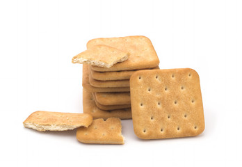 Stack of square crackers isolated on white background. Dry cracker cookies isolated