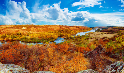 Rural autumn beautiful landscape with river and colorful trees, seasonal background