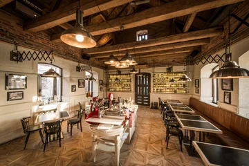 Fotobehang Tables and chairs in vintage loft restaurant © poplasen