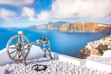 Fototapeta premium Oia town on Santorini island, Greece. Traditional and famous houses and churches with blue domes over the Caldera, Aegean sea