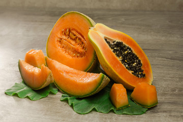 melon and papaya over wooden back