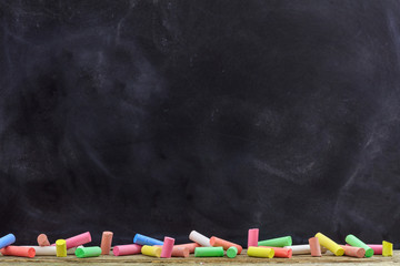 Colorful chalks and a blackboard