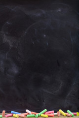 Colorful chalks and a blackboard
