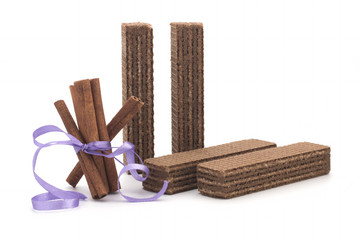 Wafers and cinnamon on a white background