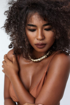 Studio portrait ethnic dark skin female model in bikini