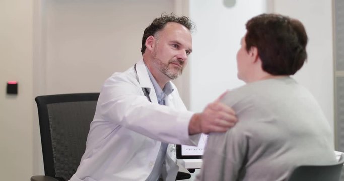 Male Medical Doctor explaining test results to patient