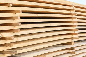 Board lying in piles on white background fresh scaffolding