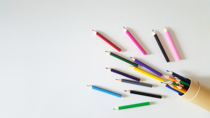 Huge set of colorful pencils on white table background. Top view.