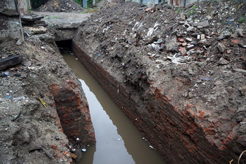 Opened for repairing sewer tunnel with waste water