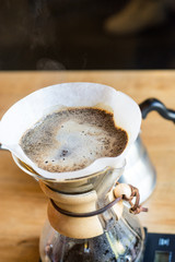 Hot morning coffee served - making of homemade arabica in filter