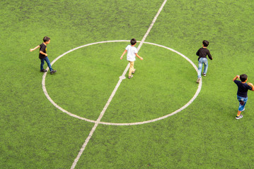 Childrens on school football playground