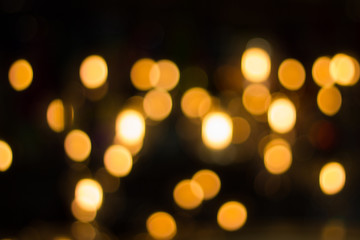 Lights blurred bokeh  - Decorative outdoor string lights hanging on tree in the garden at night...