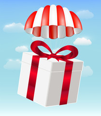 gift box with parachute on sky background